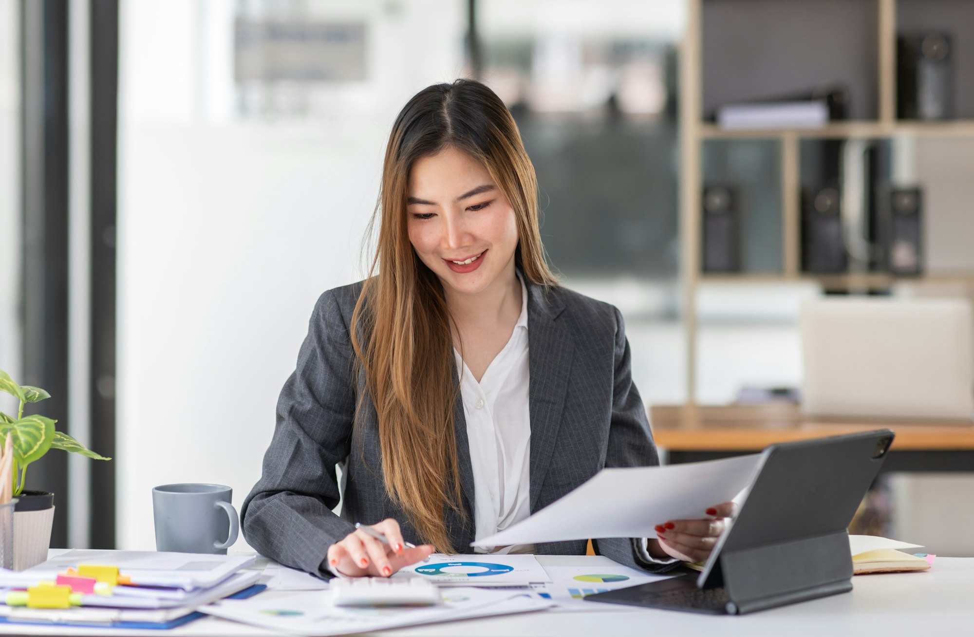 Businesswoman or accountant working Financial investment on calculator, calculate, analyze business